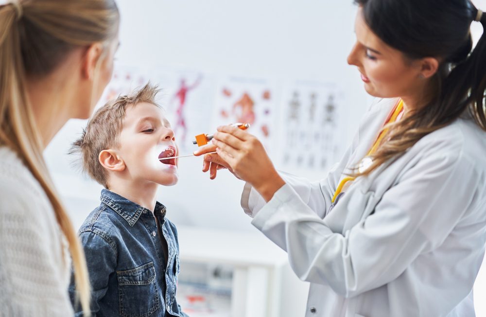 Little boy having medical examination by pediatrician