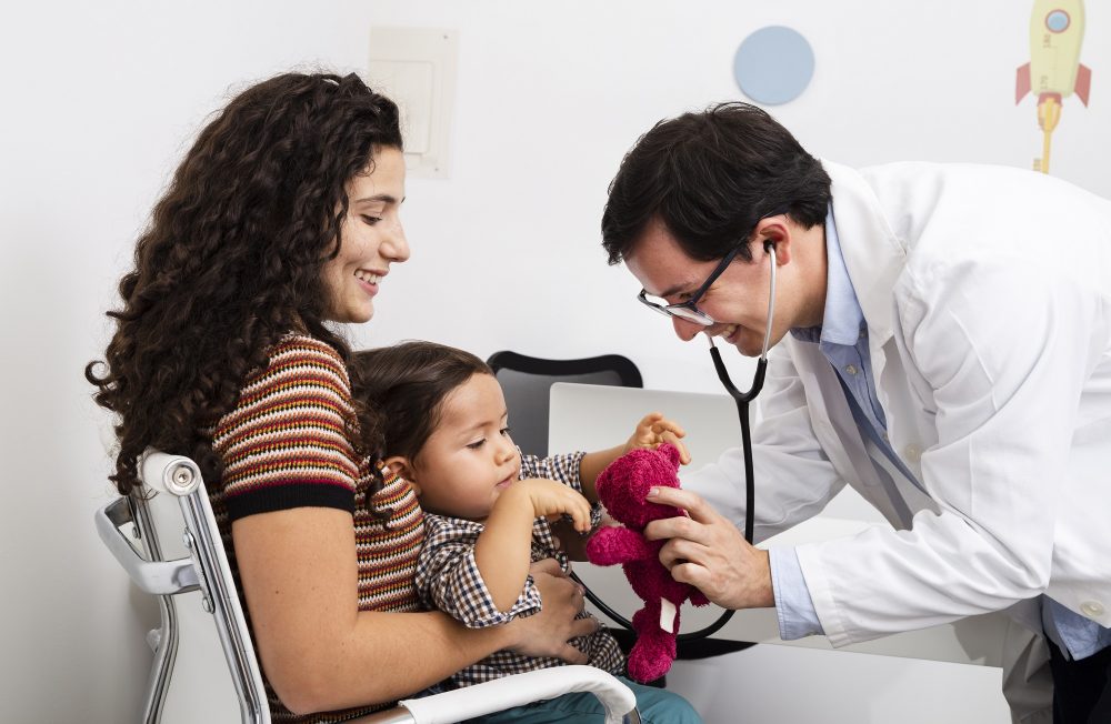 side-view-doctor-checking-baby-boy